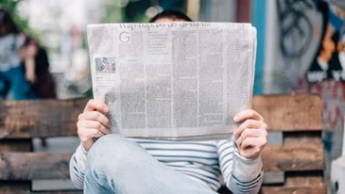 Person Reading How the News Media Makes Money