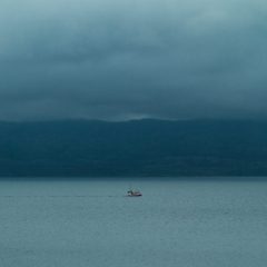 Isolation vs. loneliness boat in body of water